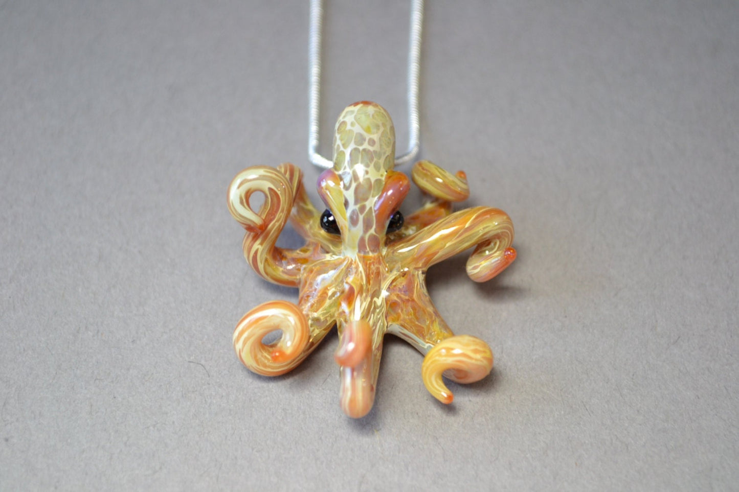 Pacific Octopus Pendant Necklace with multiple colors of Carmel and Brown a Great Gift Idea for Him or Her