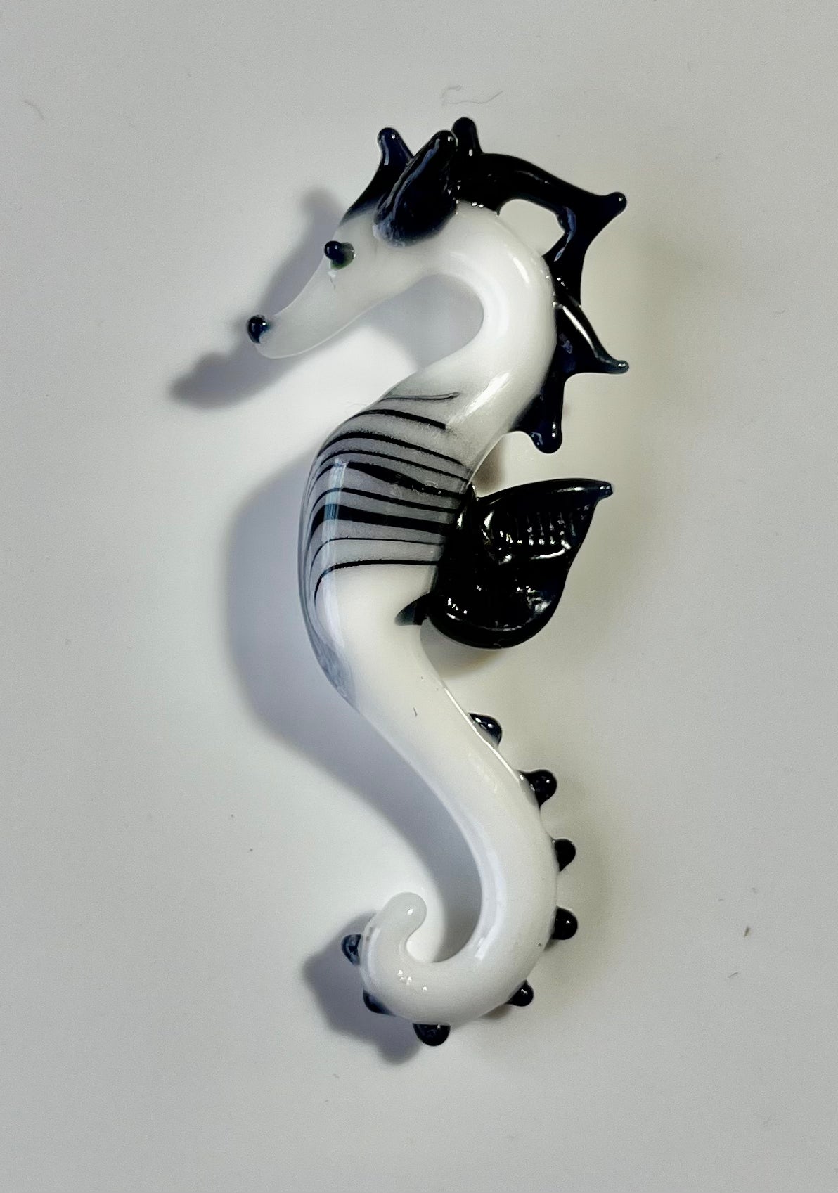 Sea Horse Splendor: Hand-Blown Black and White Glass Pendant - GLASSnFIRE